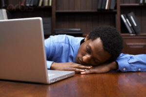 Businessman Sleeping on the Job --- Image by © Sean Justice/Corbis