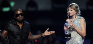 NEW YORK - SEPTEMBER 13: Kanye West takes the microphone from Taylor Swift and speaks onstage during the 2009 MTV Video Music Awards at Radio City Music Hall on September 13, 2009 in New York City. (Photo by Kevin Mazur/WireImage)